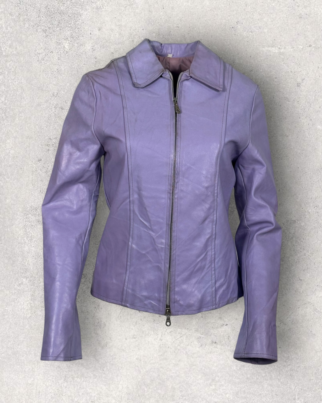 Purple leather jacket on a textured gray background